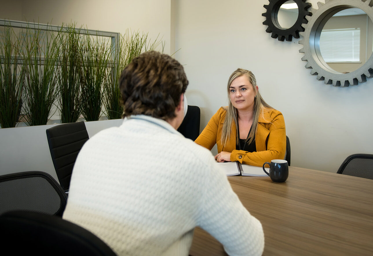 BECN staff chats with client