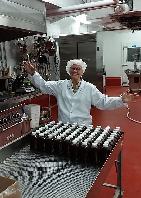 Saucy Dotty Gourmet Sauce prepping products in kitchen