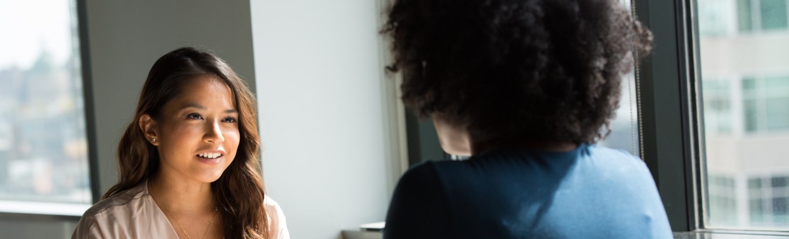Woman chats with client